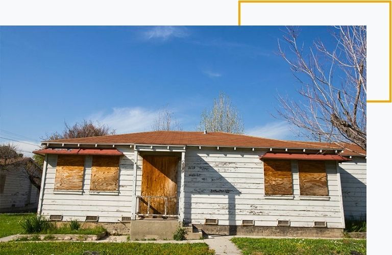 exterior view of an abandoned home