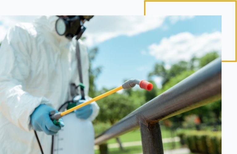 spraying a handrail outdoors